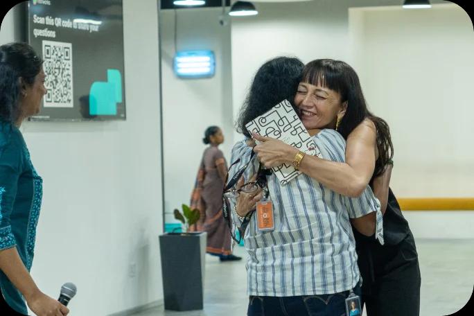 Office scene at Freshworks’ Denver office, showing smiling employees